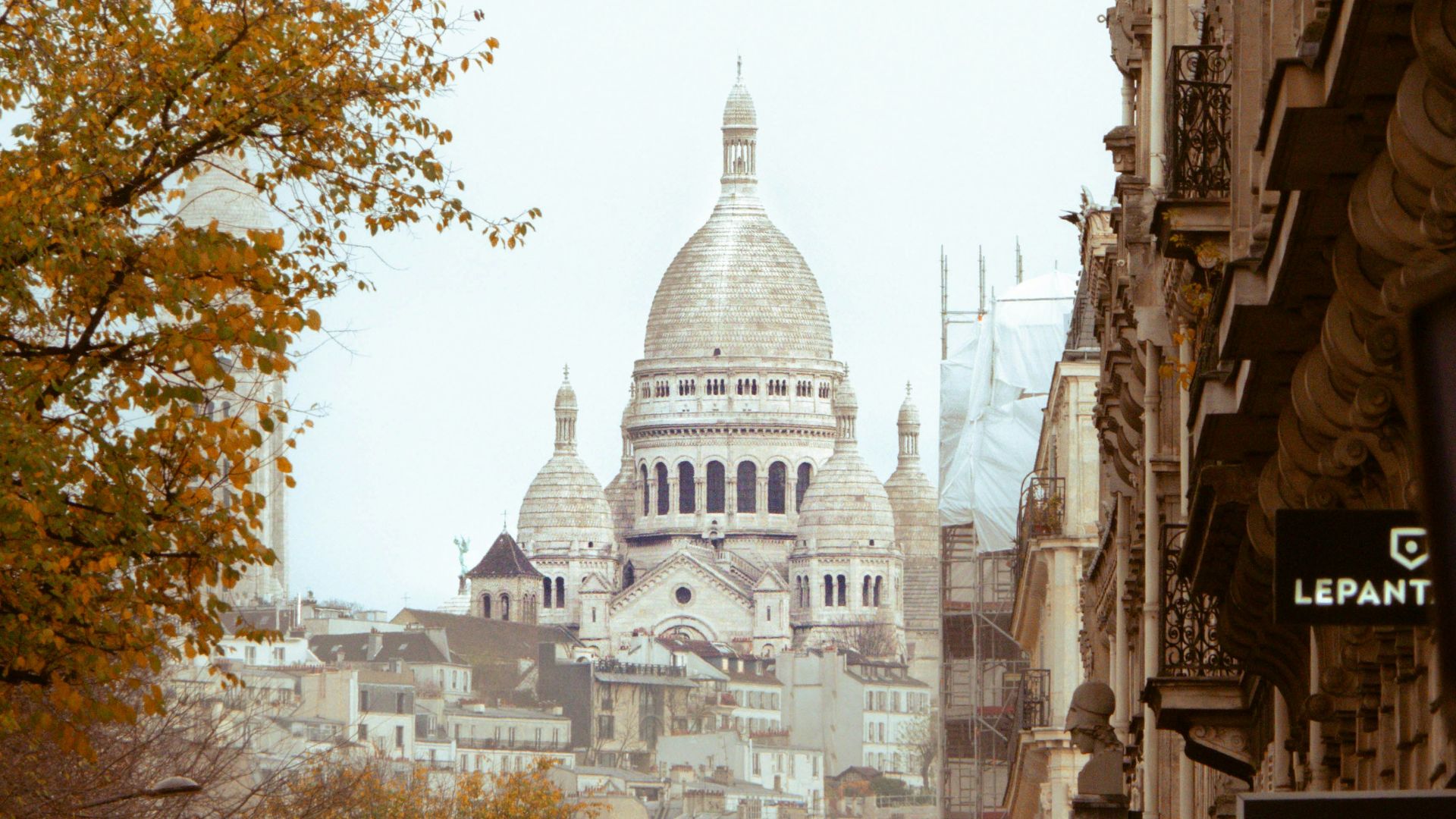 a view of a city with a cathedral in the background