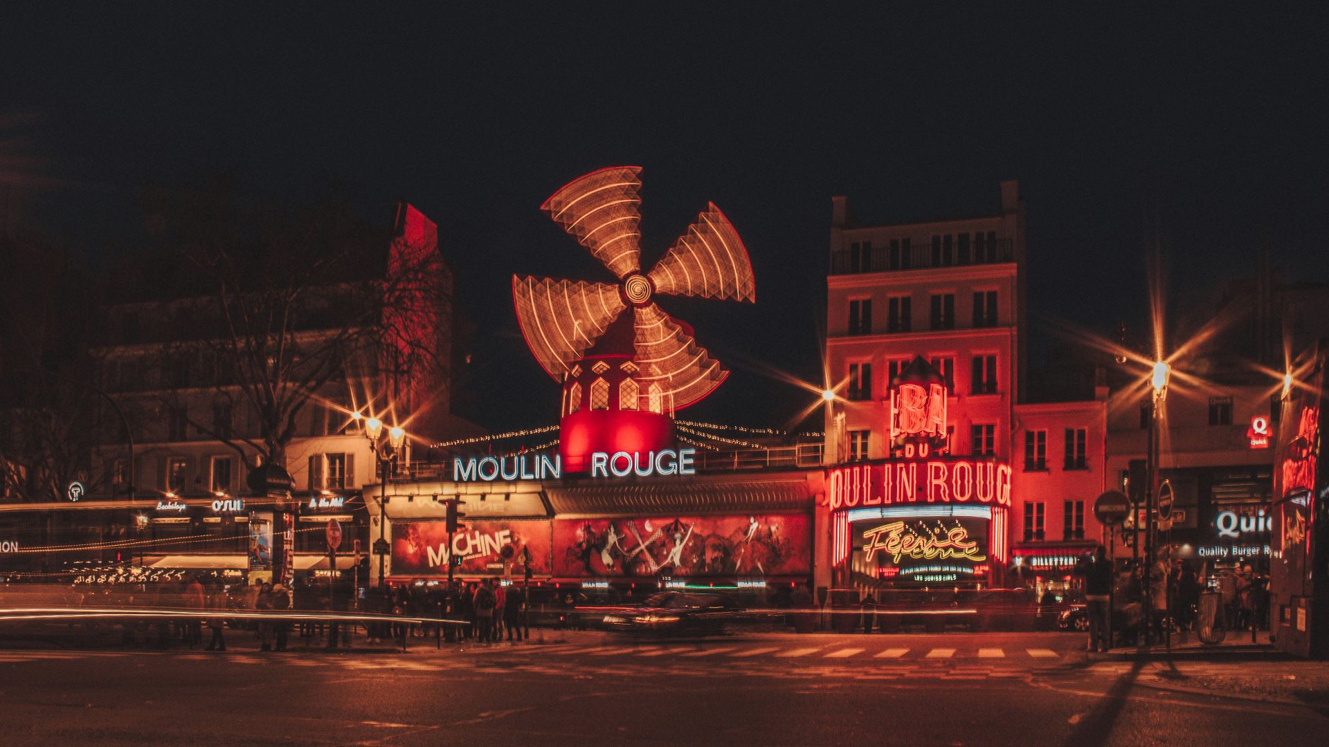 Moulin Rouge building beside road during nighttime