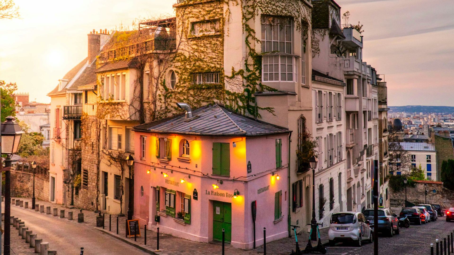 people walking on sidewalk near buildings during daytime