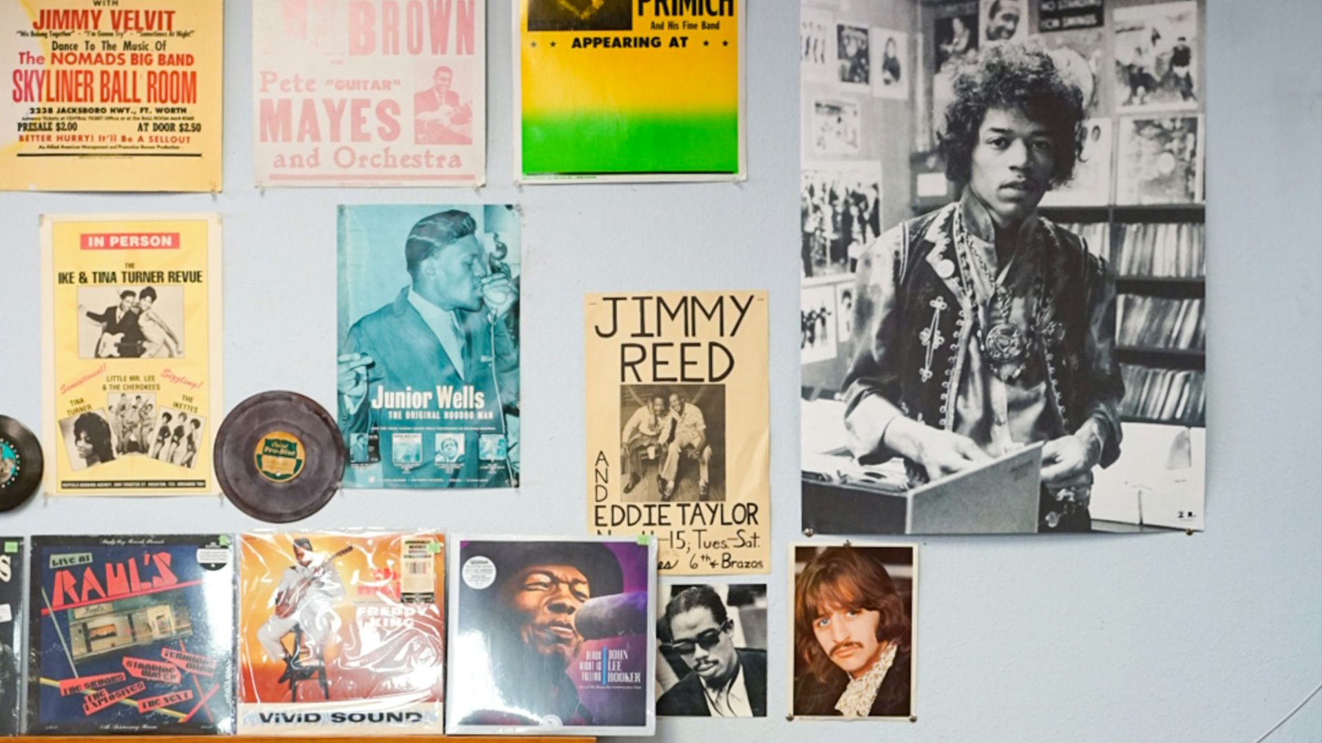 assorted vinyl record on brown wooden shelf