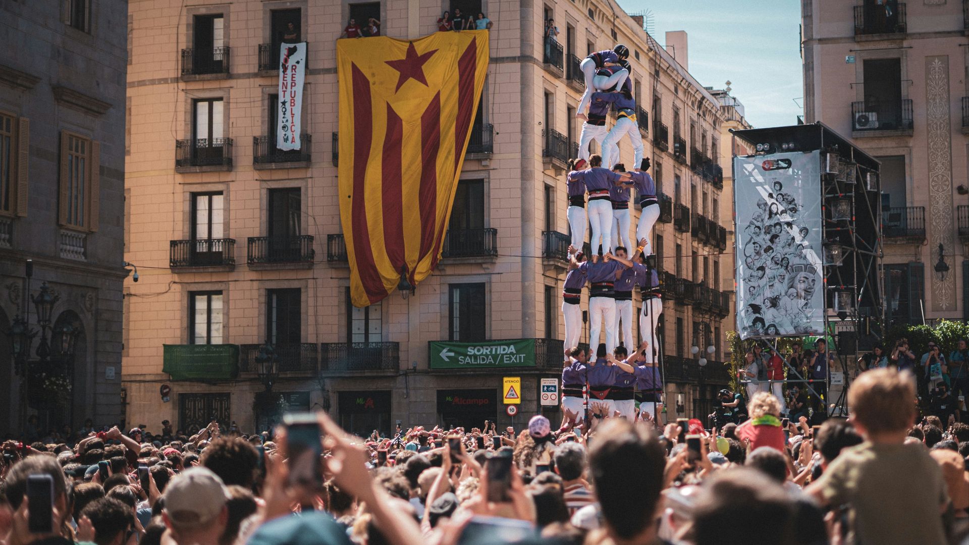 People watch a human tower performance.