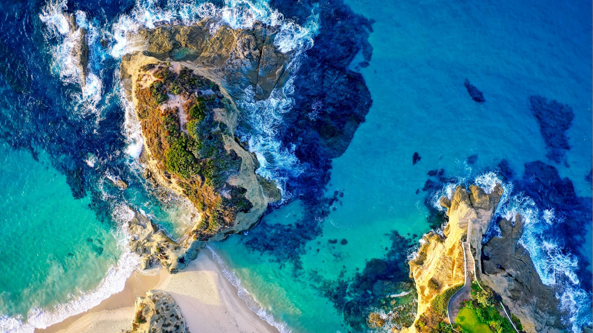 aerial photography of island beside sea