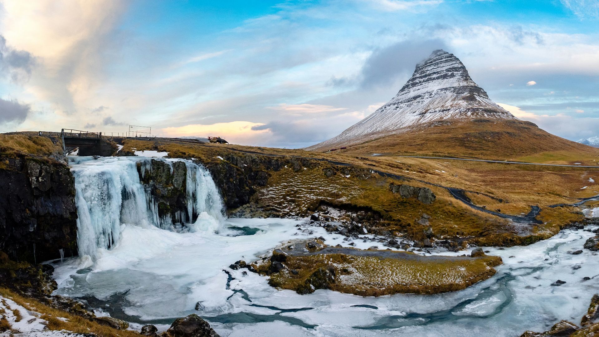 falls surrounded with grass field and snow