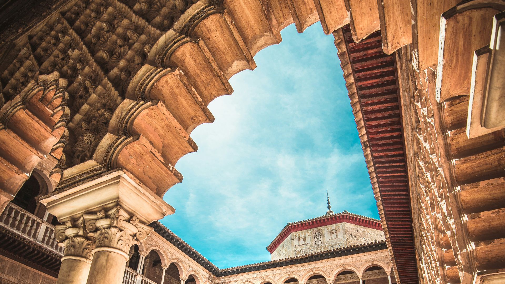 brown concrete 3-storey house
