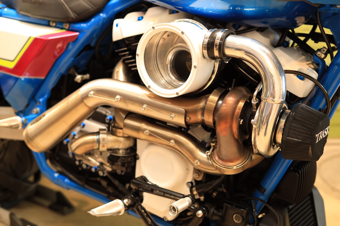 a close up of a blue motorcycle engine