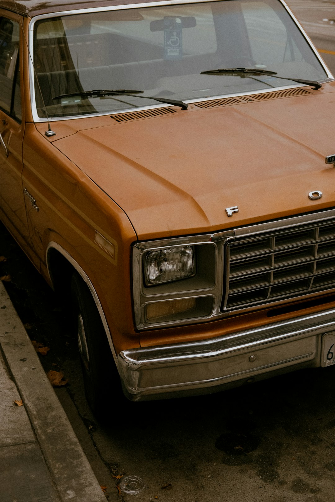 a brown truck parked on the side of the road