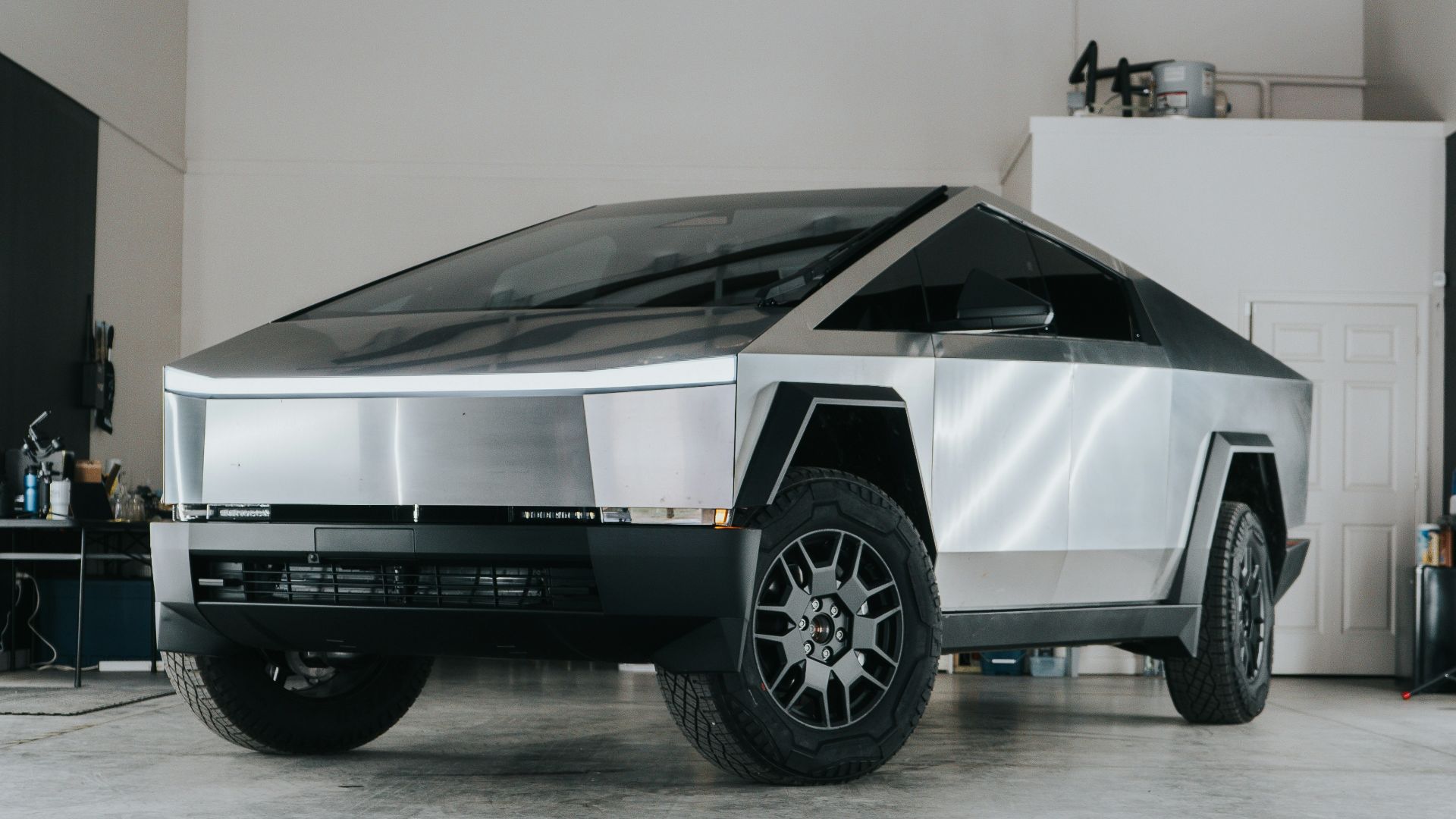 A futuristic car is parked in a garage