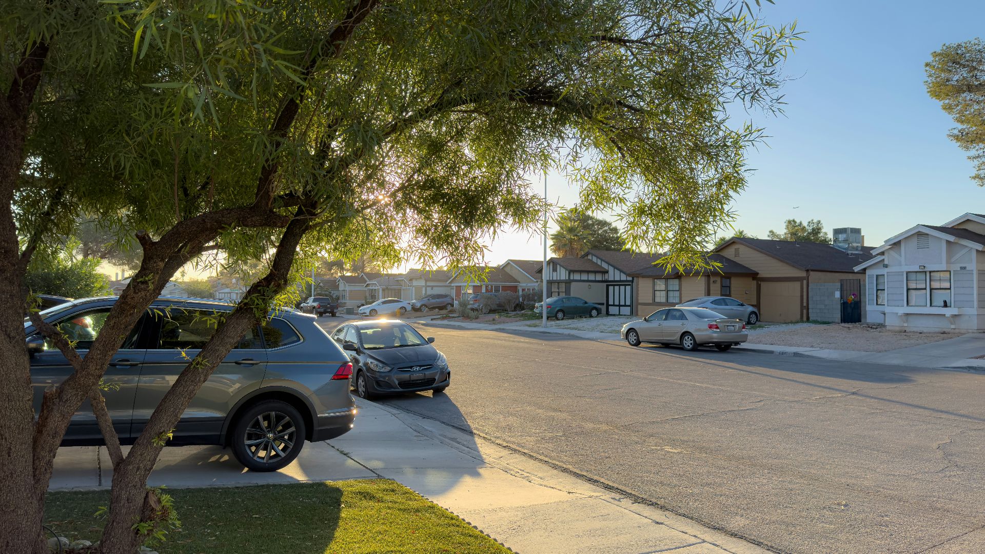a couple of cars parked on the side of a road