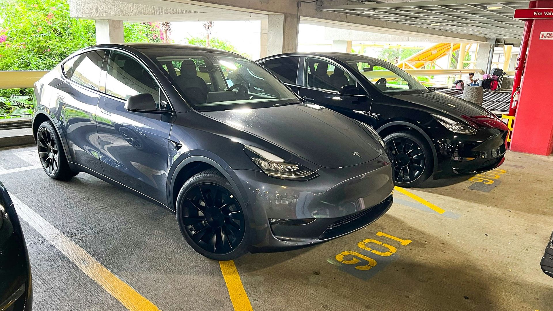 a couple of cars parked in a parking garage