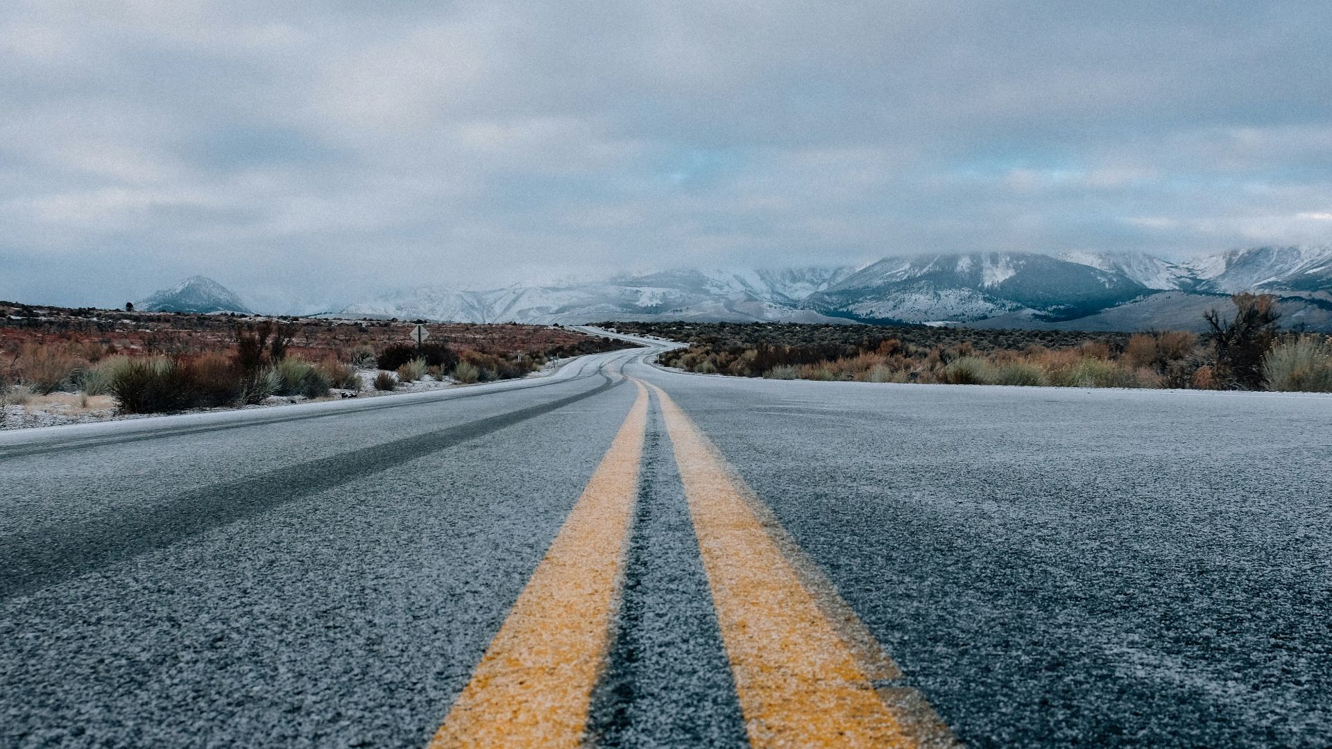 landscape photography of asphalt road under cloudy sky during daytime