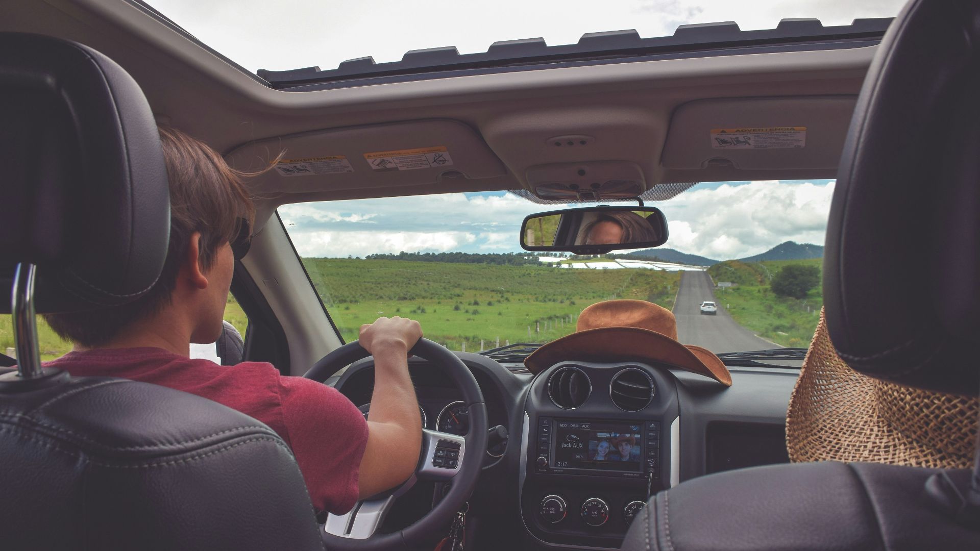 man driving straight on pathway during day time