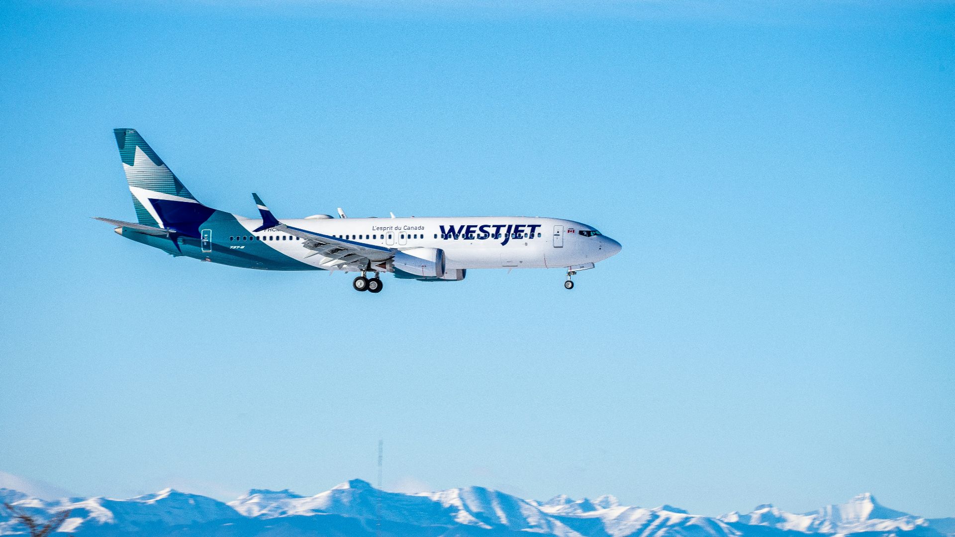 white and red airplane flying during daytime