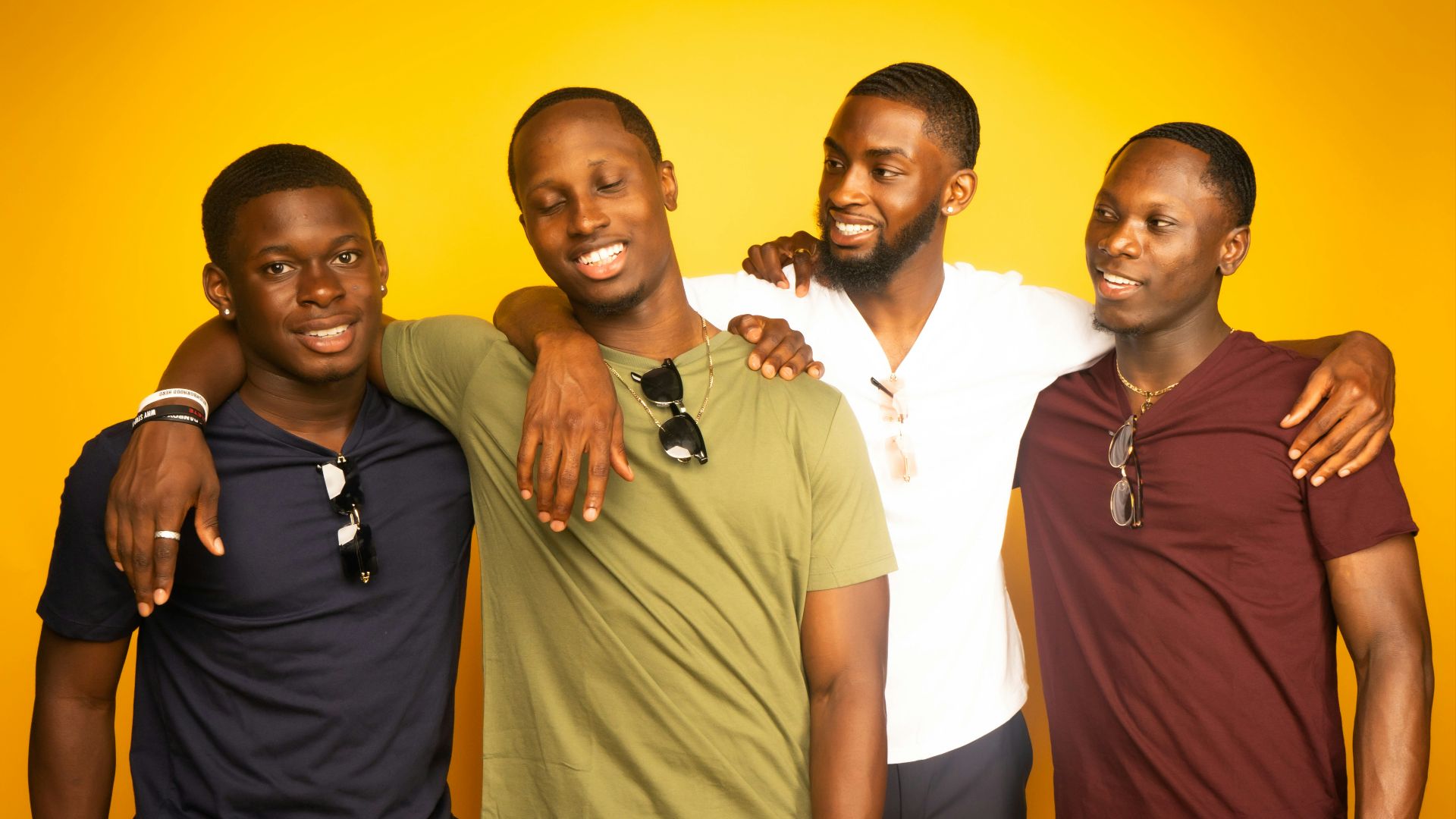 3 men and 2 women standing side by side