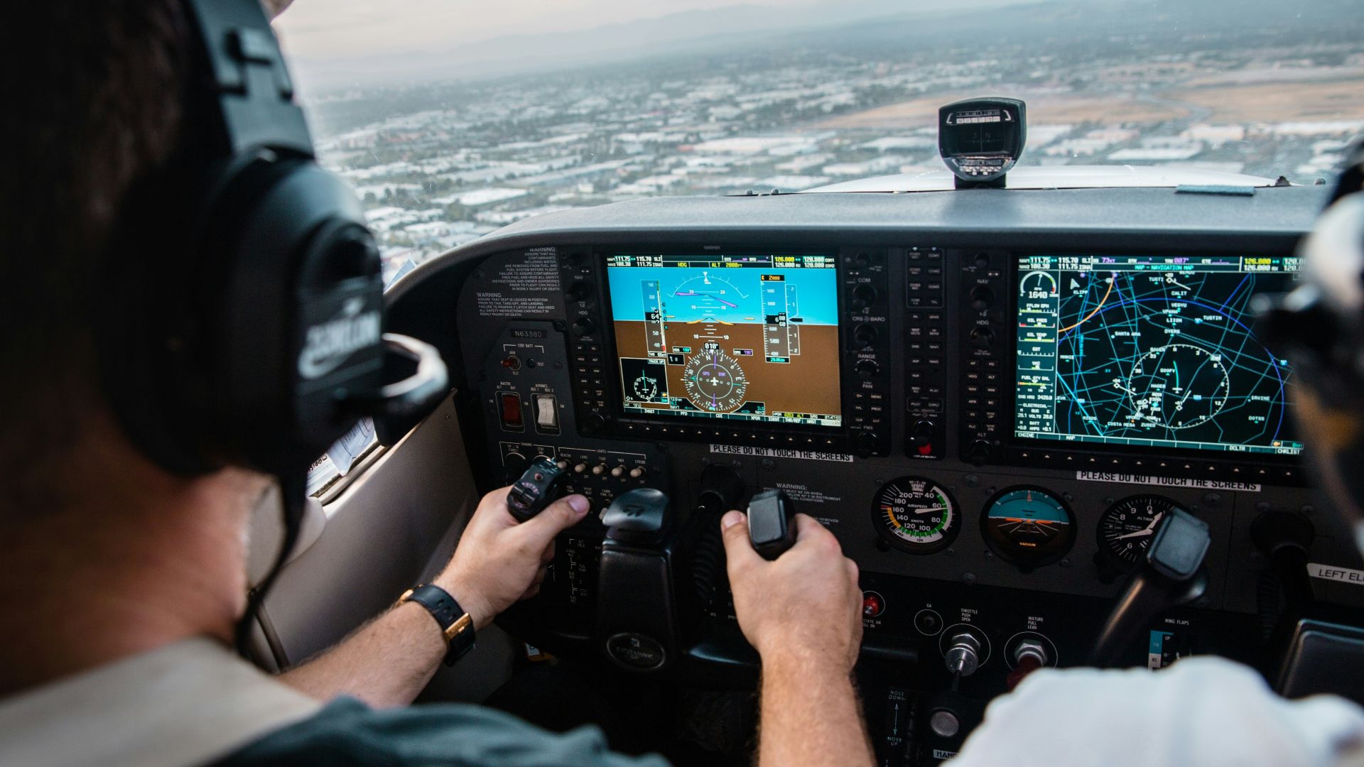 man flying aircraft under cloudy sky