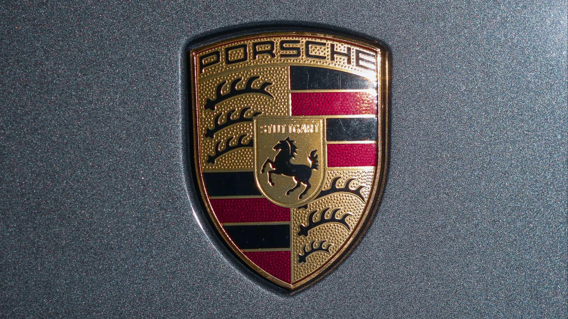 a close up of a porsche emblem on a car