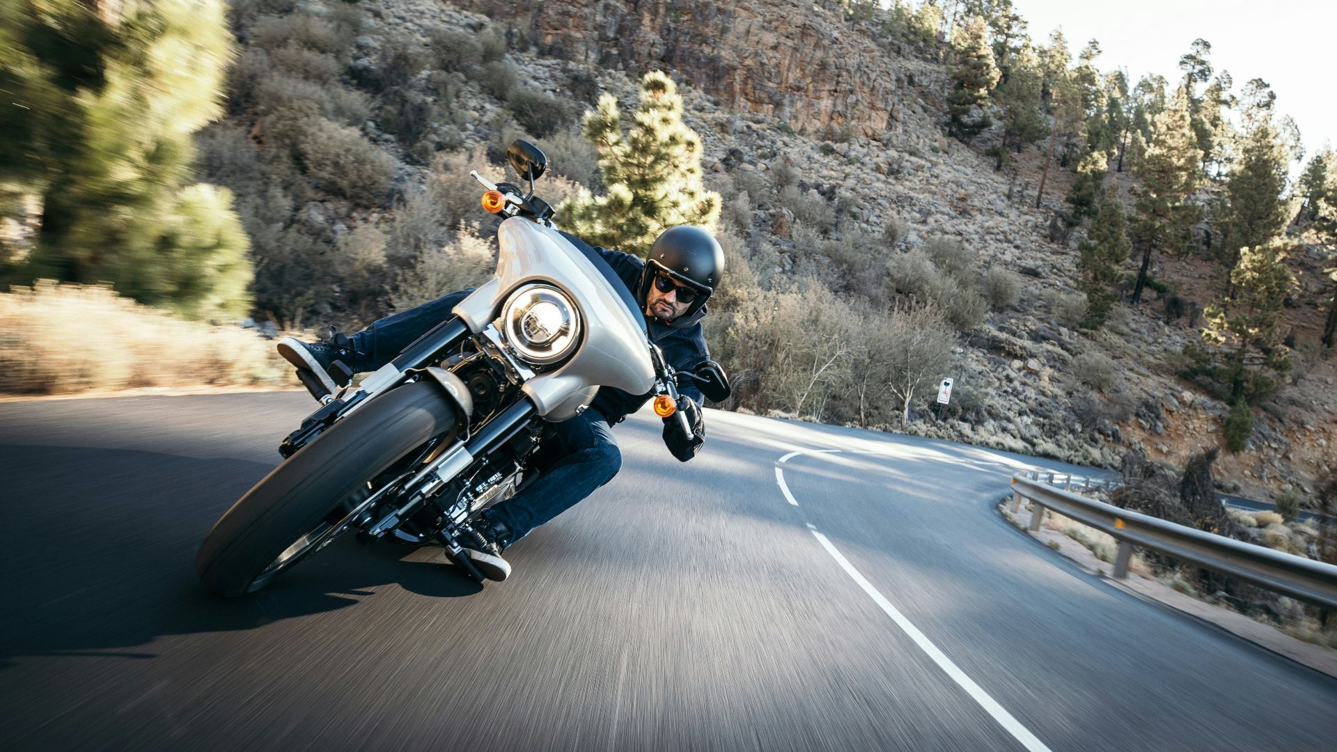 man riding motorcycle at the road during daytime