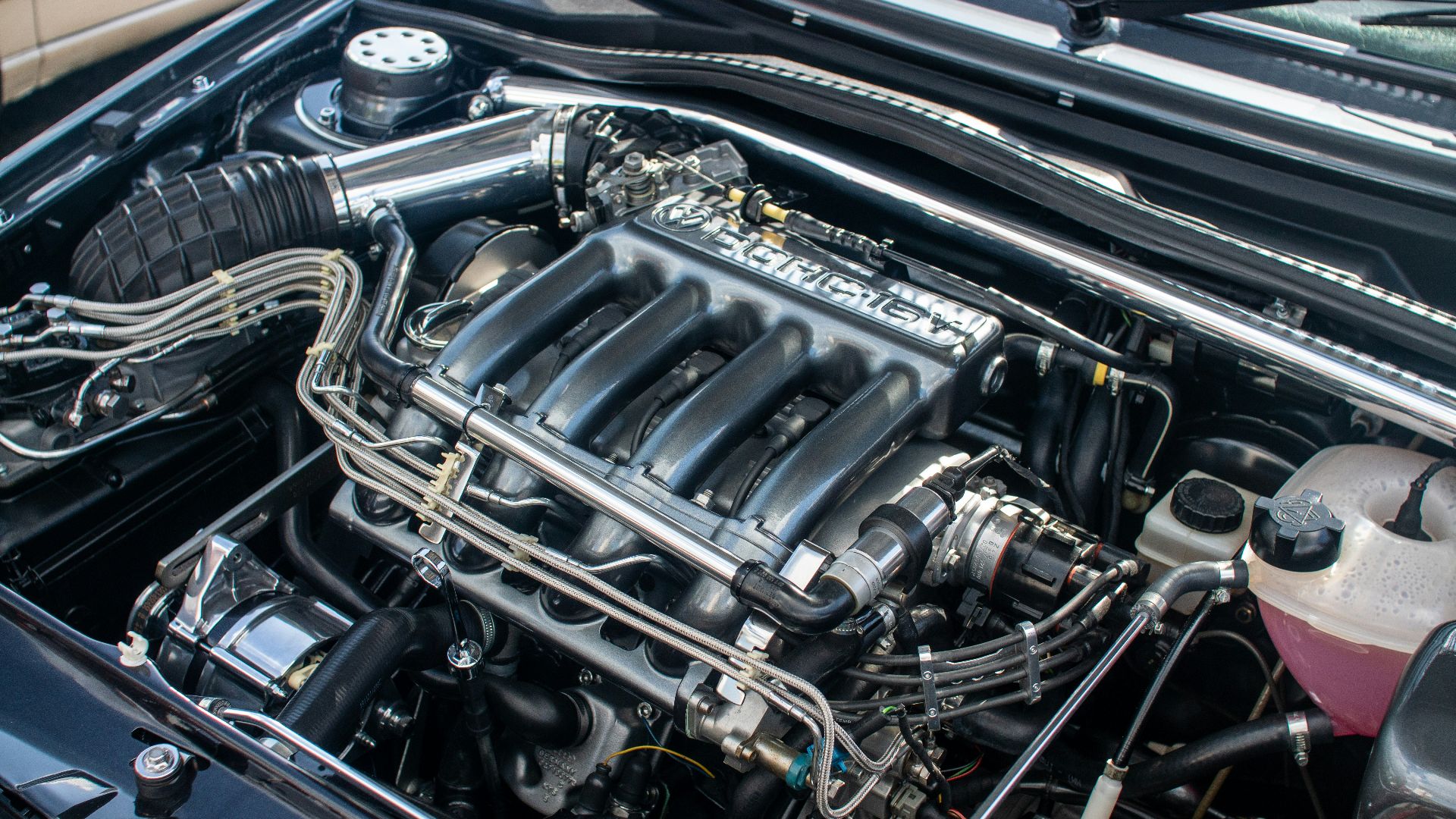 The engine compartment of a car with the hood up