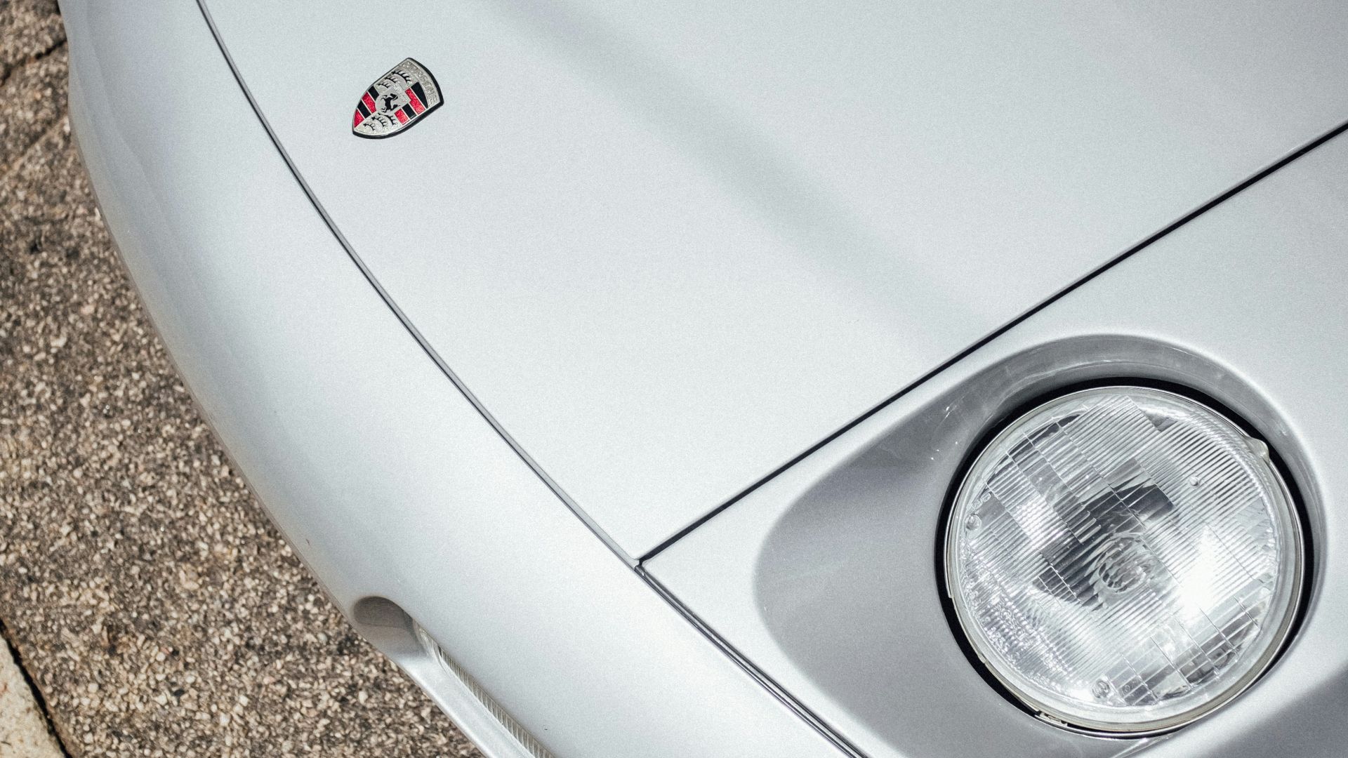 white car on brown concrete floor