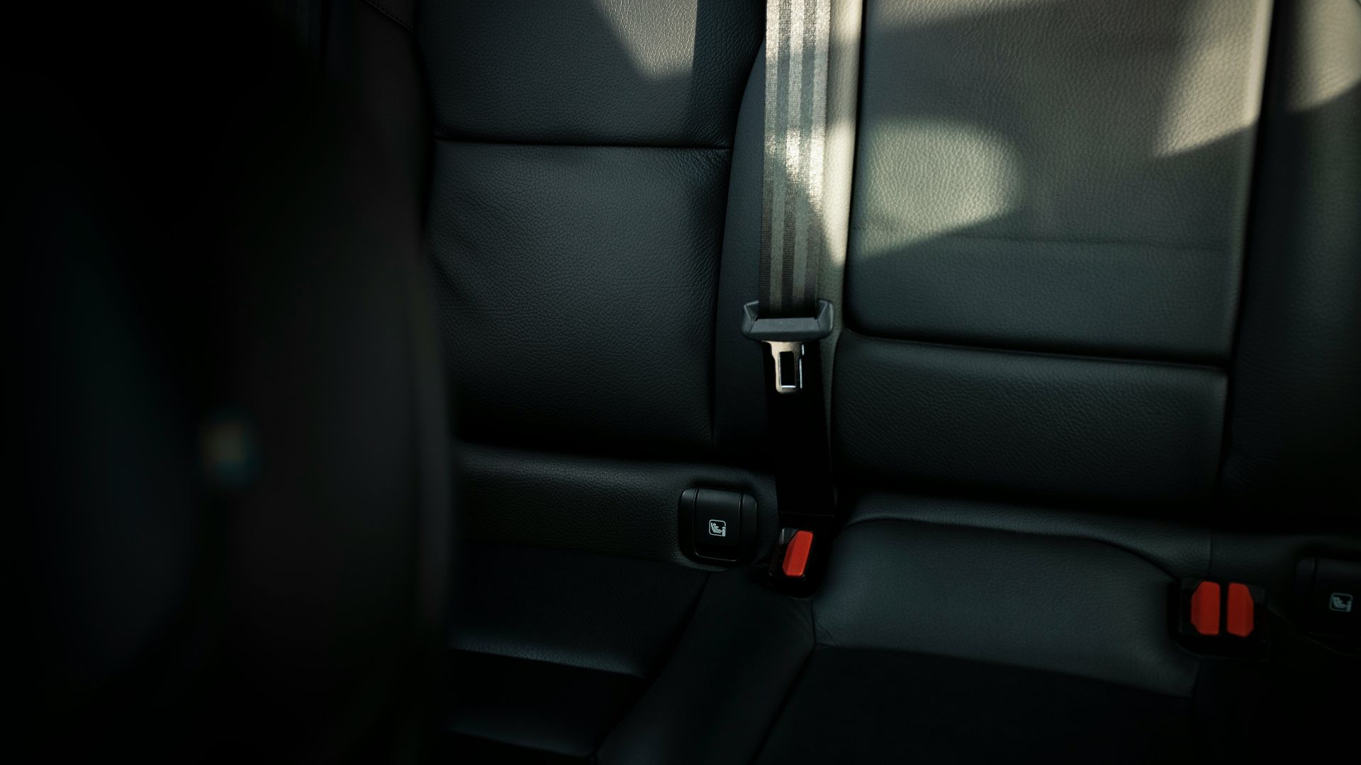 black leather car seat with seat belt