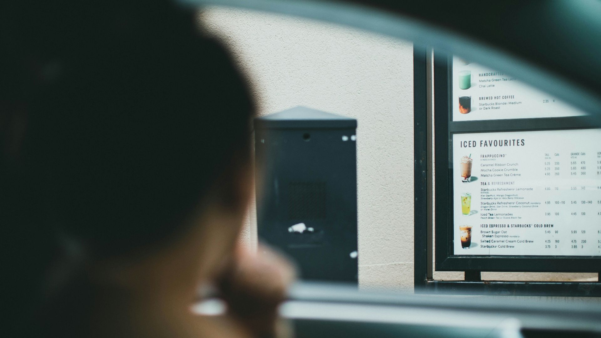 person holding black smartphone in car