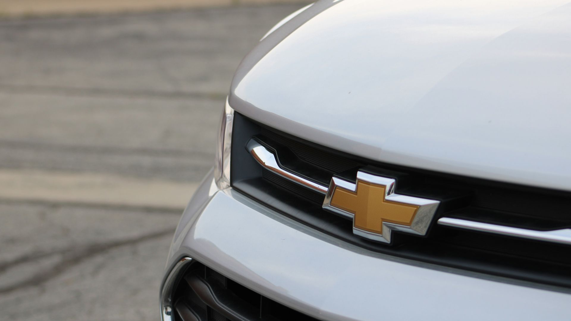 white chevrolet car on road during daytime