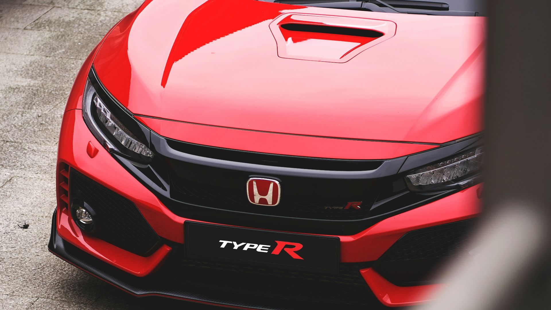 red Honda vehicle