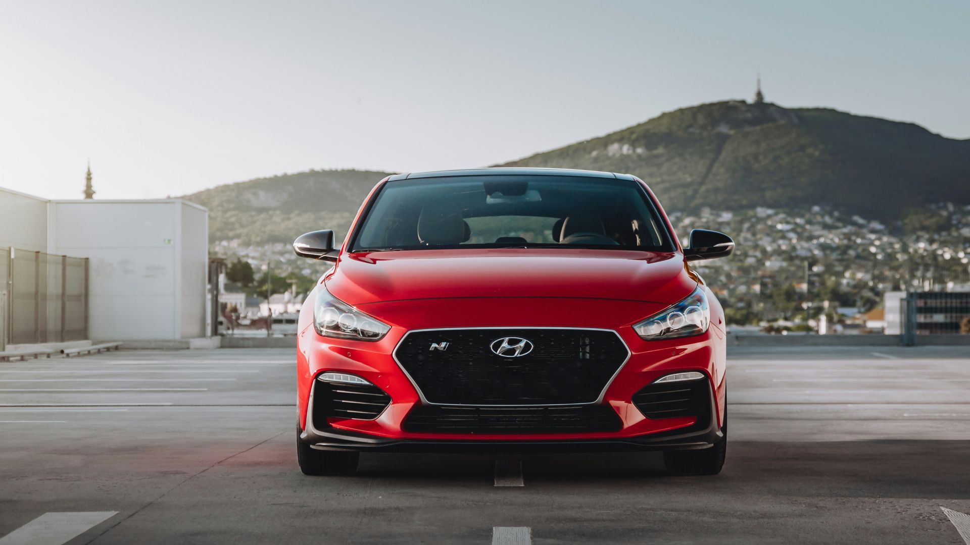 red bmw m 3 on road during daytime
