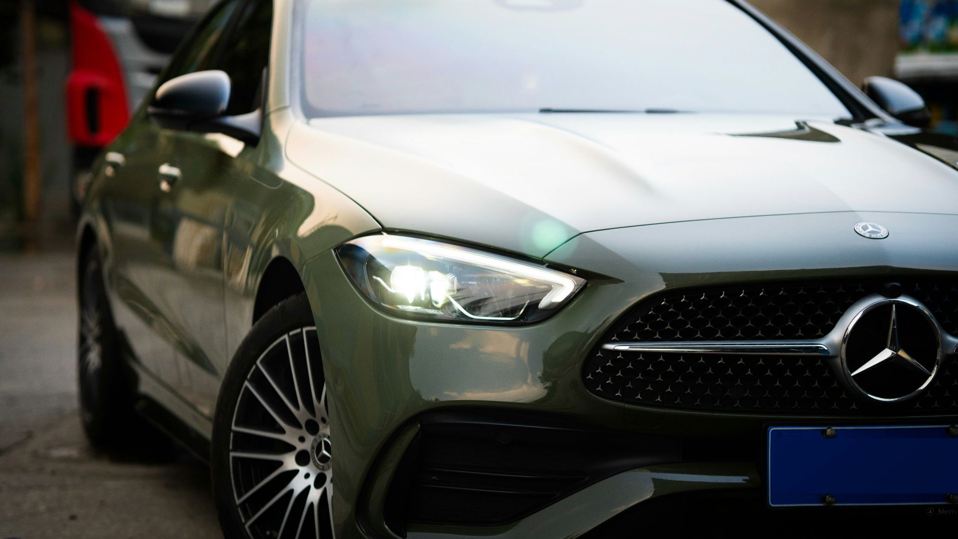 a close up of a car parked on a street