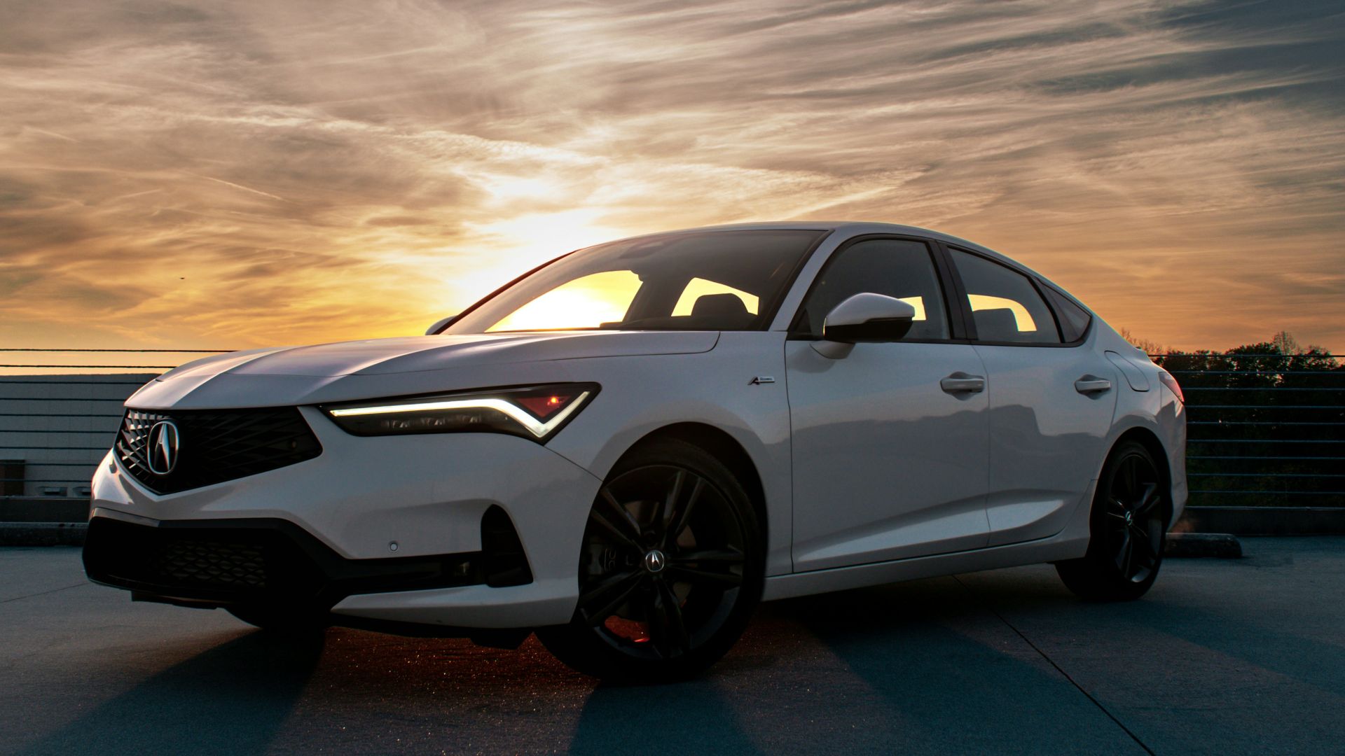 a white car parked on pavement