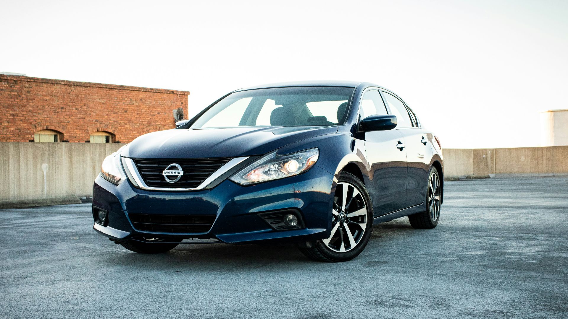 white bmw m 3 coupe parked on gray concrete pavement during daytime