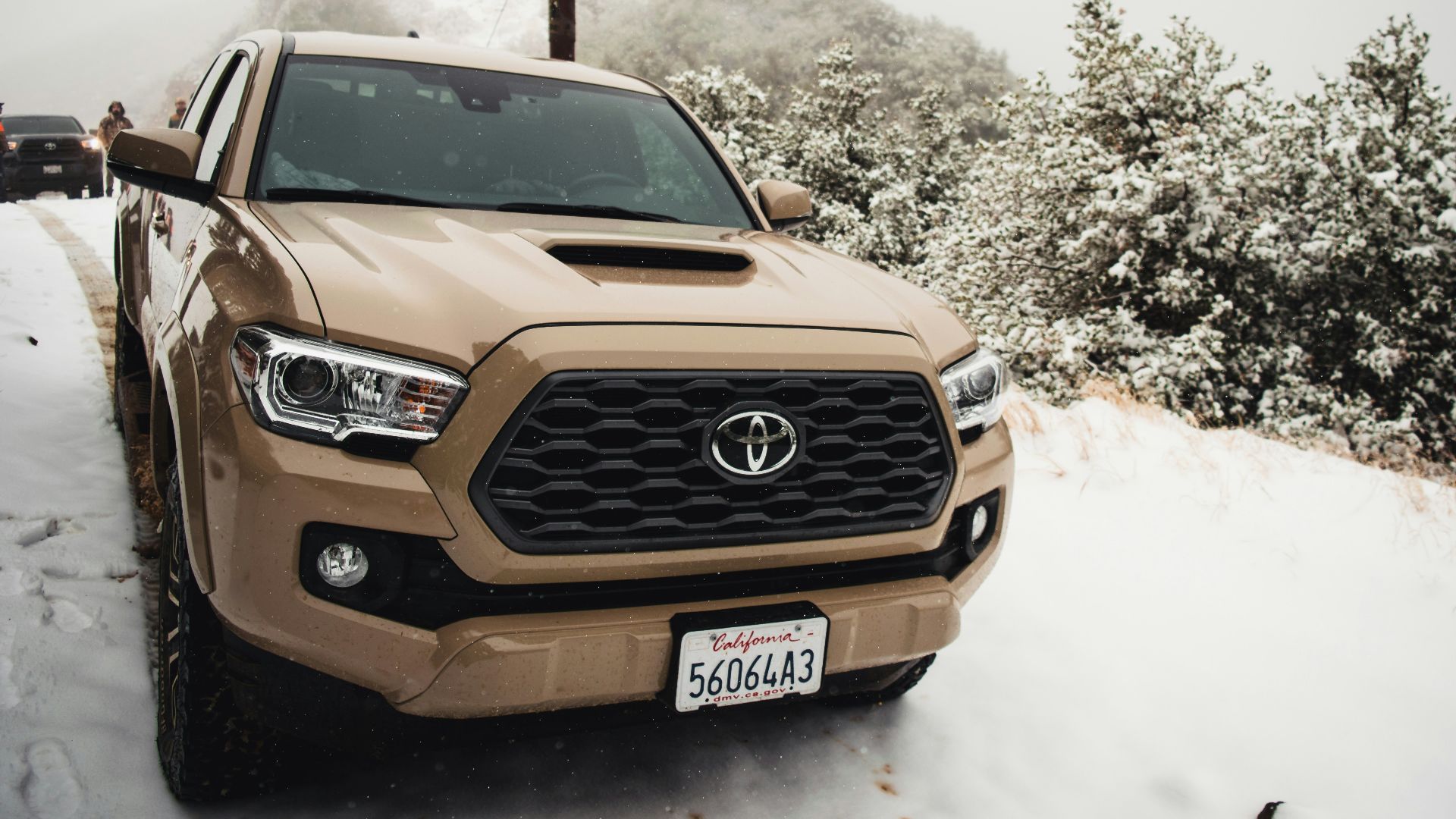 brown mercedes benz car on snow covered ground during daytime