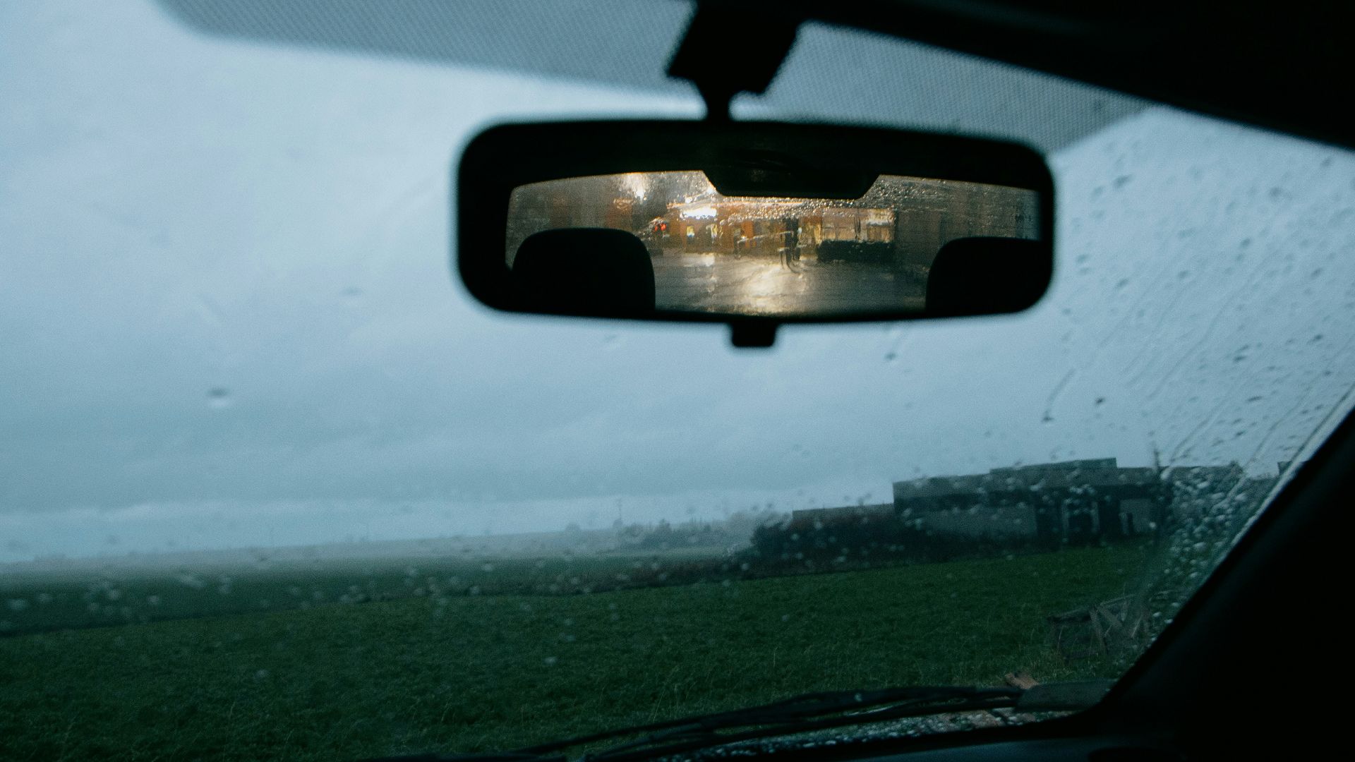 car window with water droplets