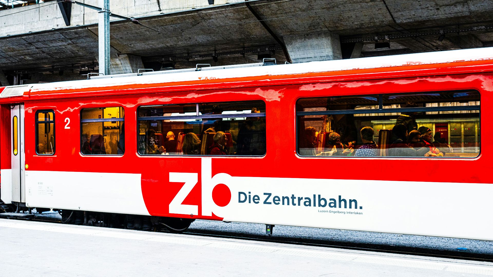 A red train at the station.