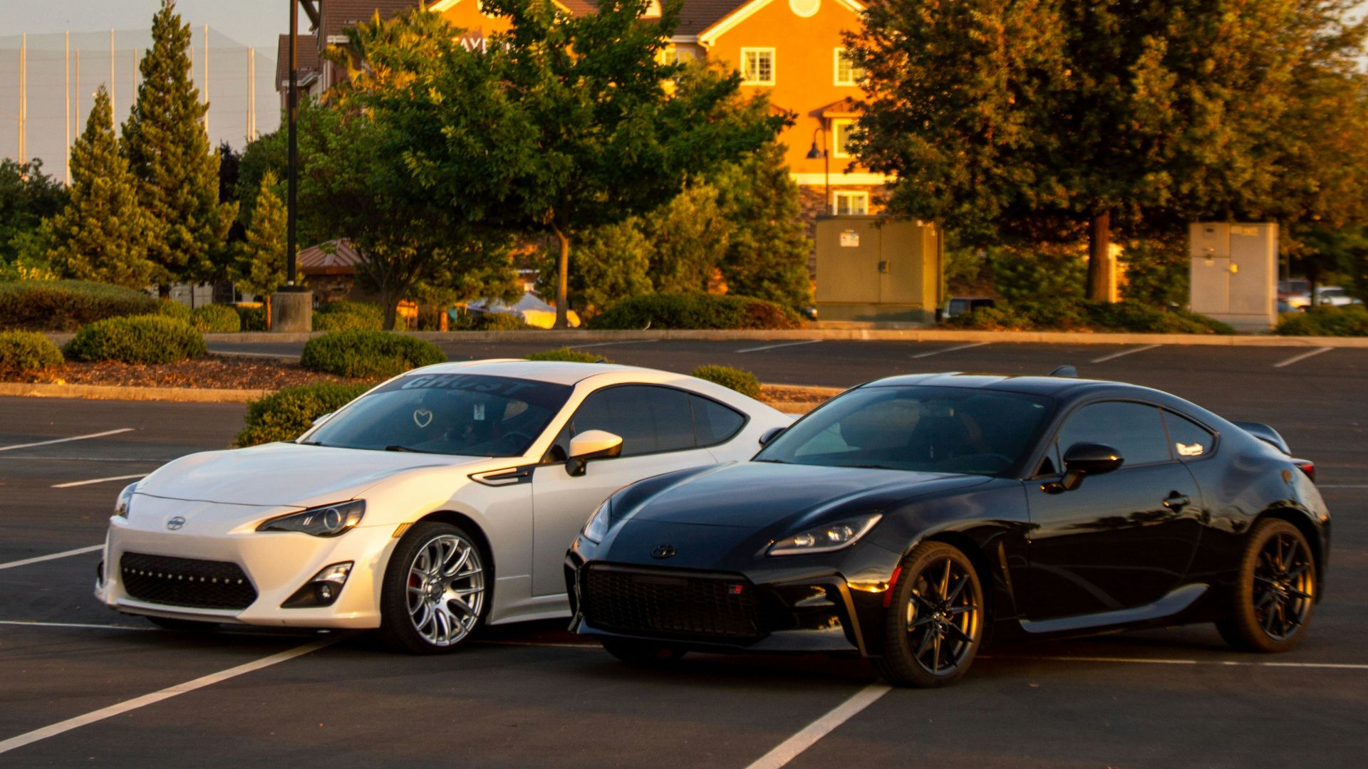 a couple of cars parked in a parking lot