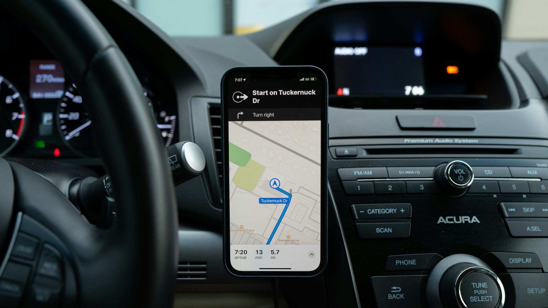 black android smartphone on car center console