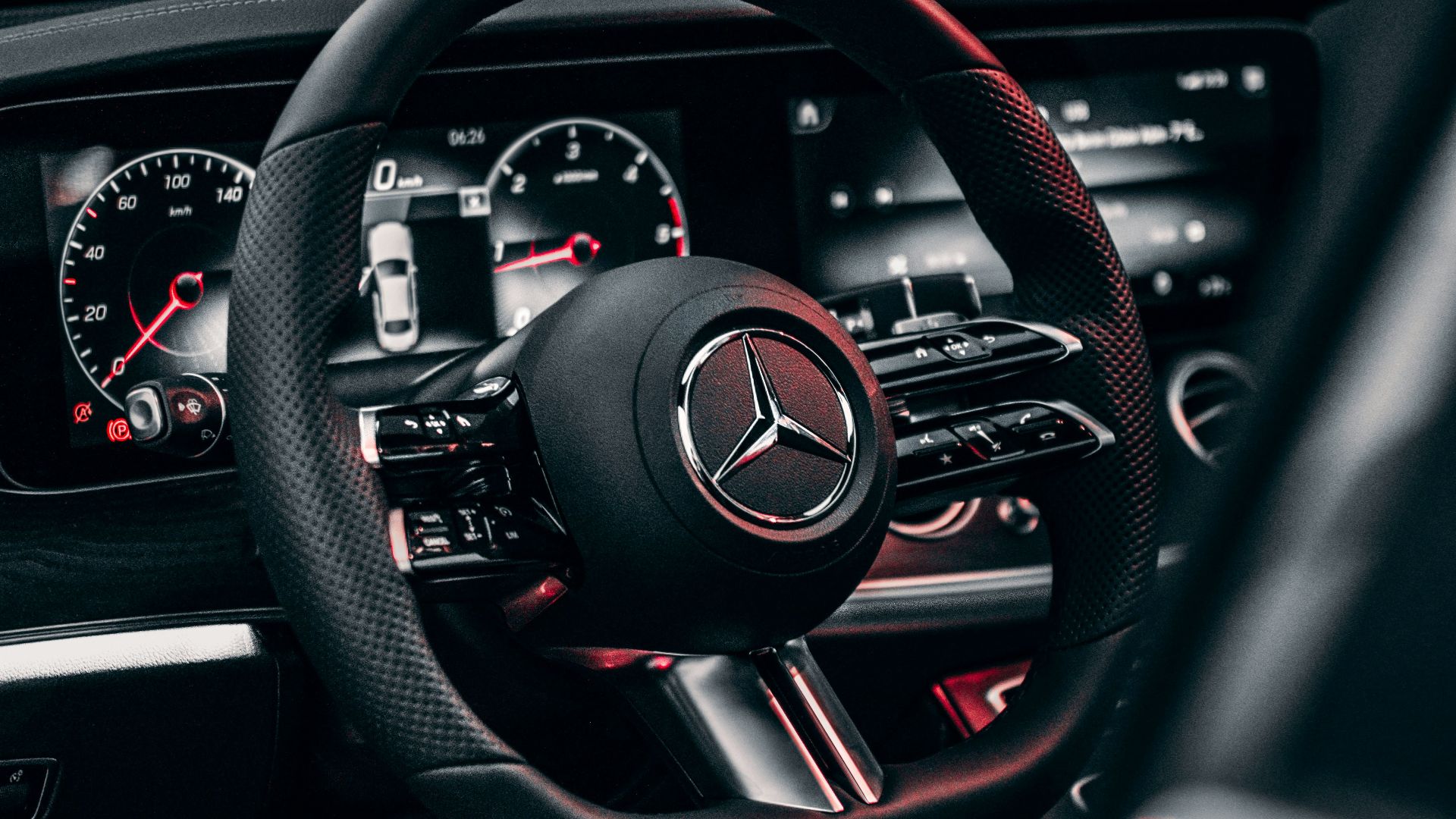 the steering wheel and dashboard of a car