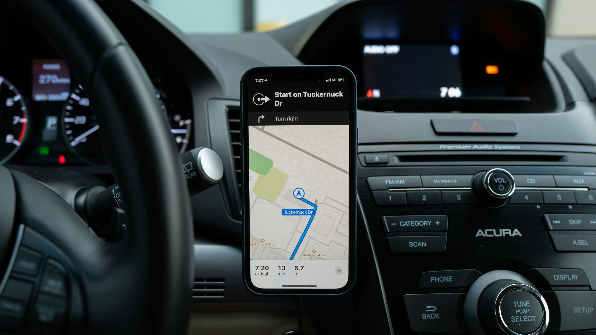 black android smartphone on car center console