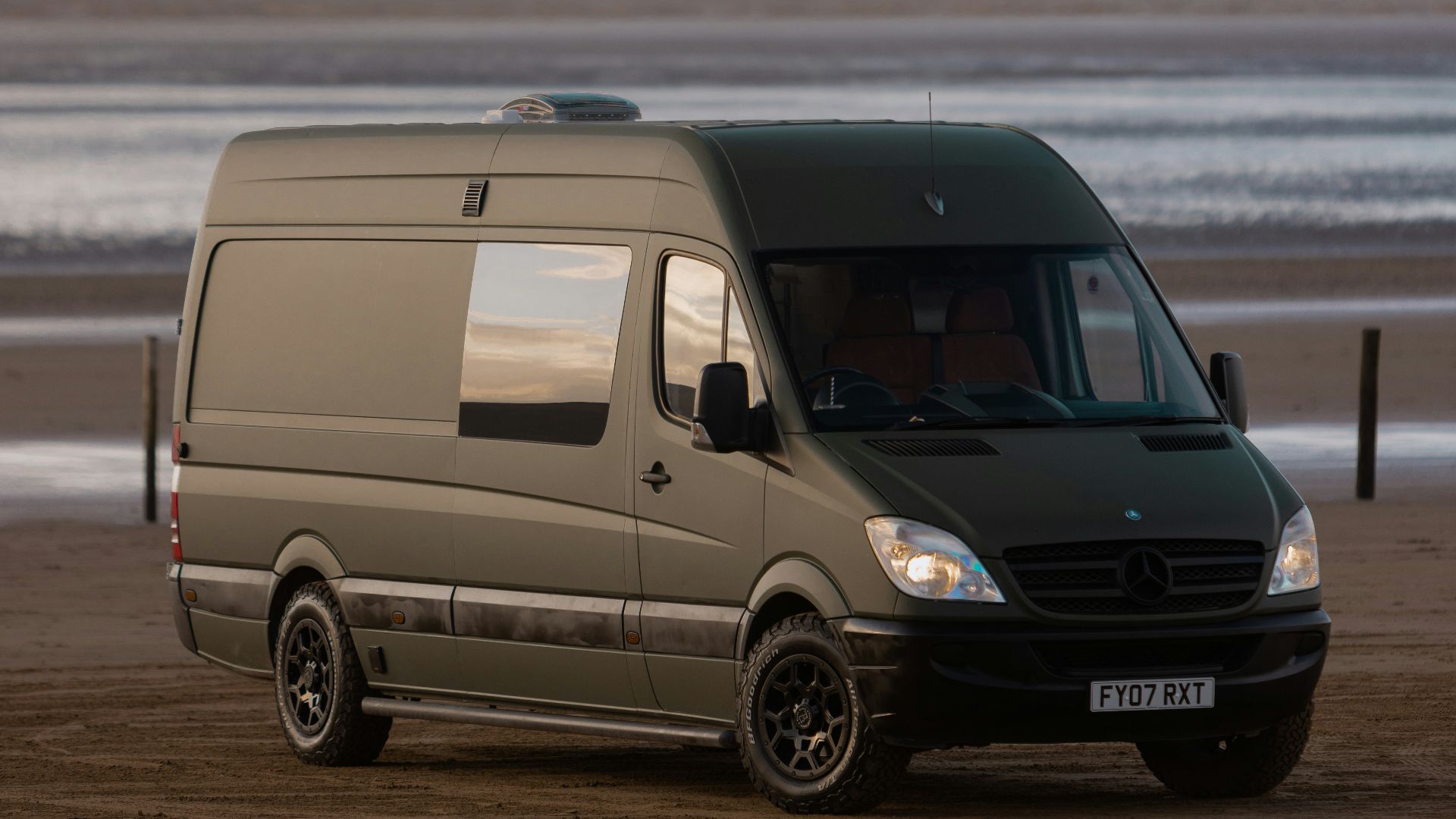 a van parked on a beach