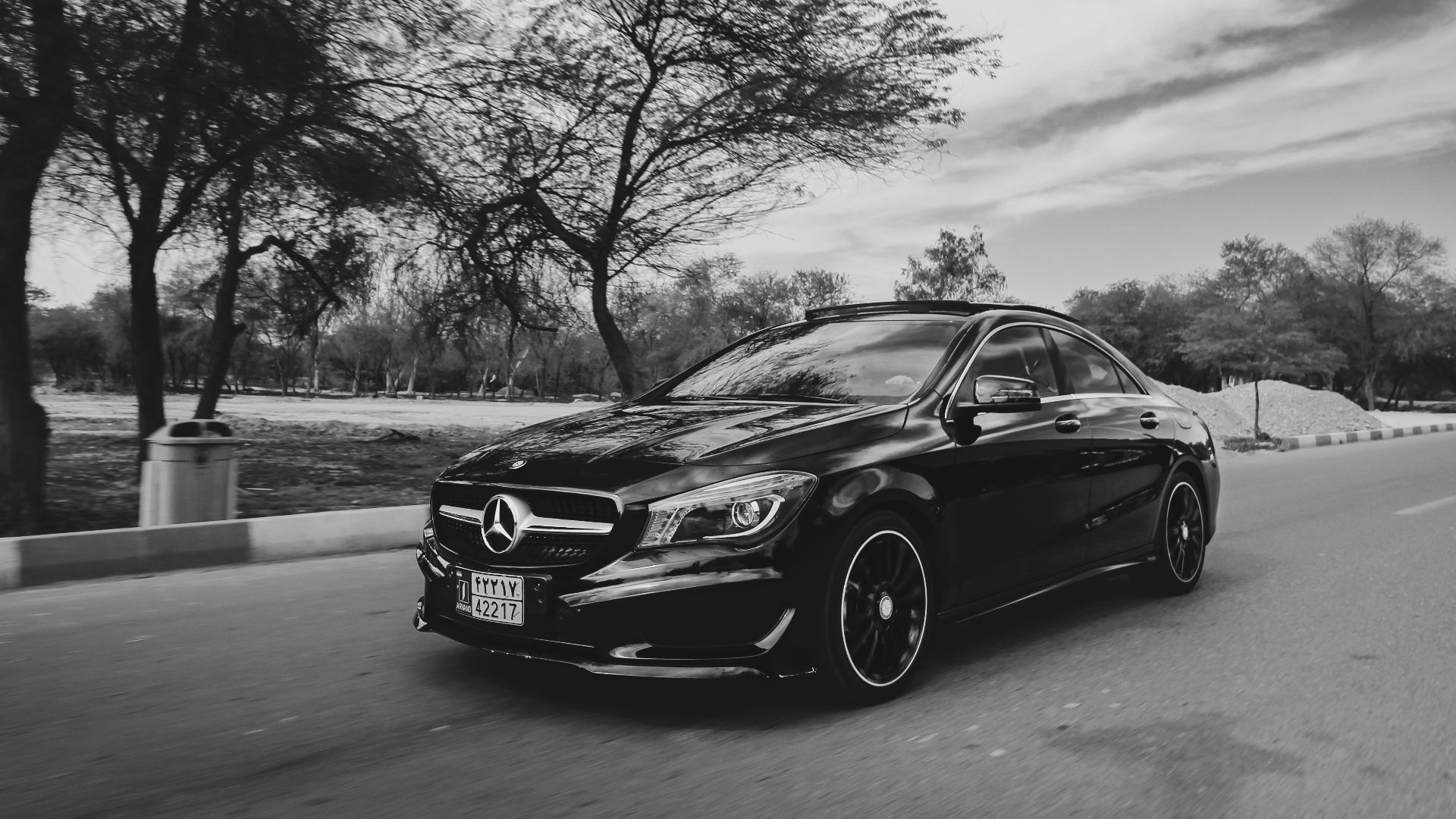 grayscale photo of black bmw m 3 coupe on road