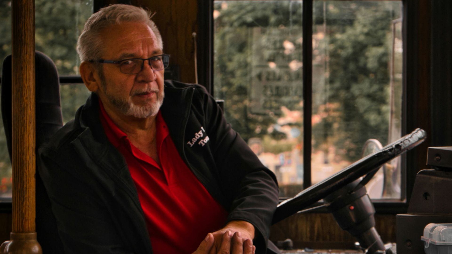 a man sitting in a chair next to a window