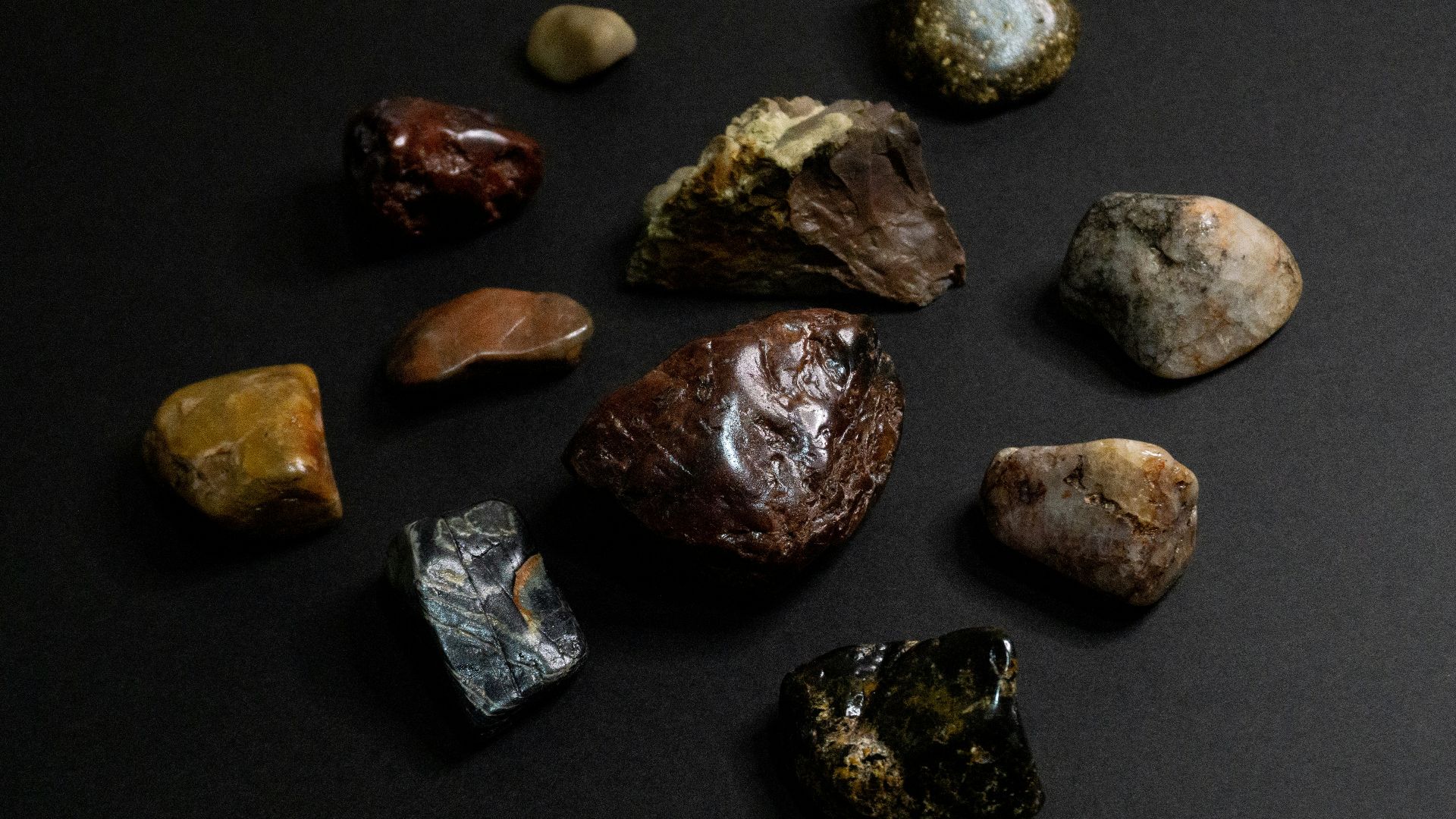 a group of rocks sitting on top of a black surface