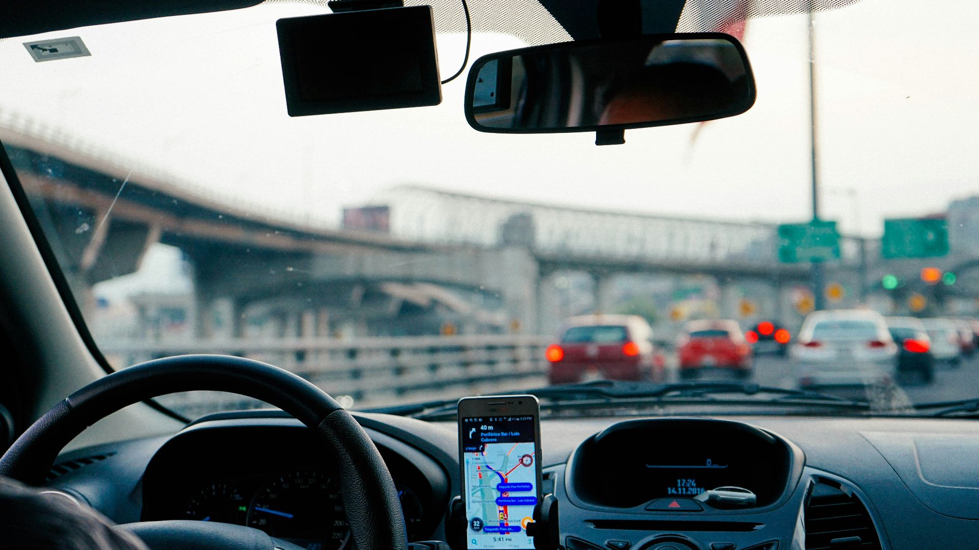 man driving vehicle with GPS system turned on