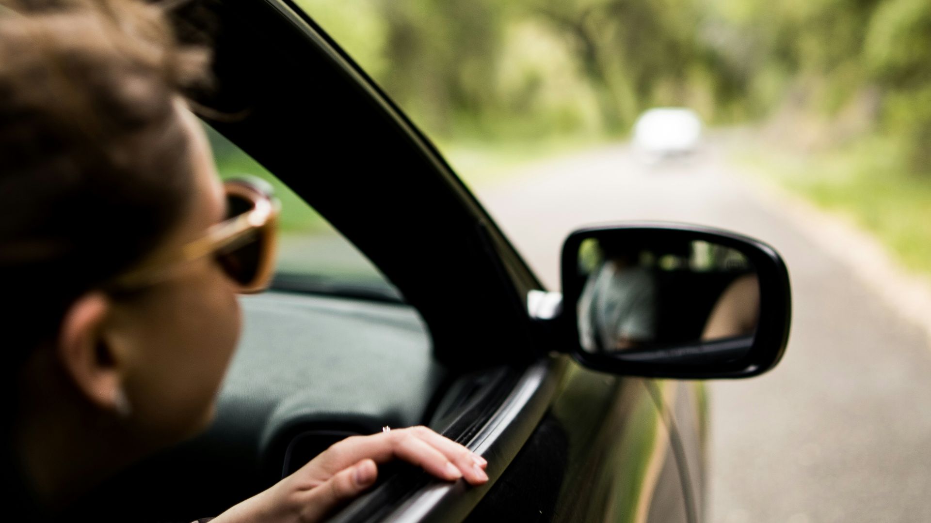 woman sitting inside vehicle