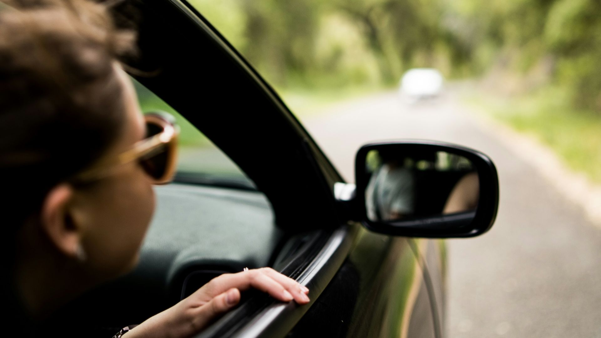 woman sitting inside vehicle