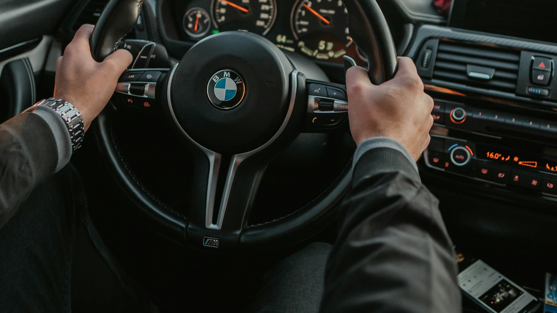 unknown person driving BMW car