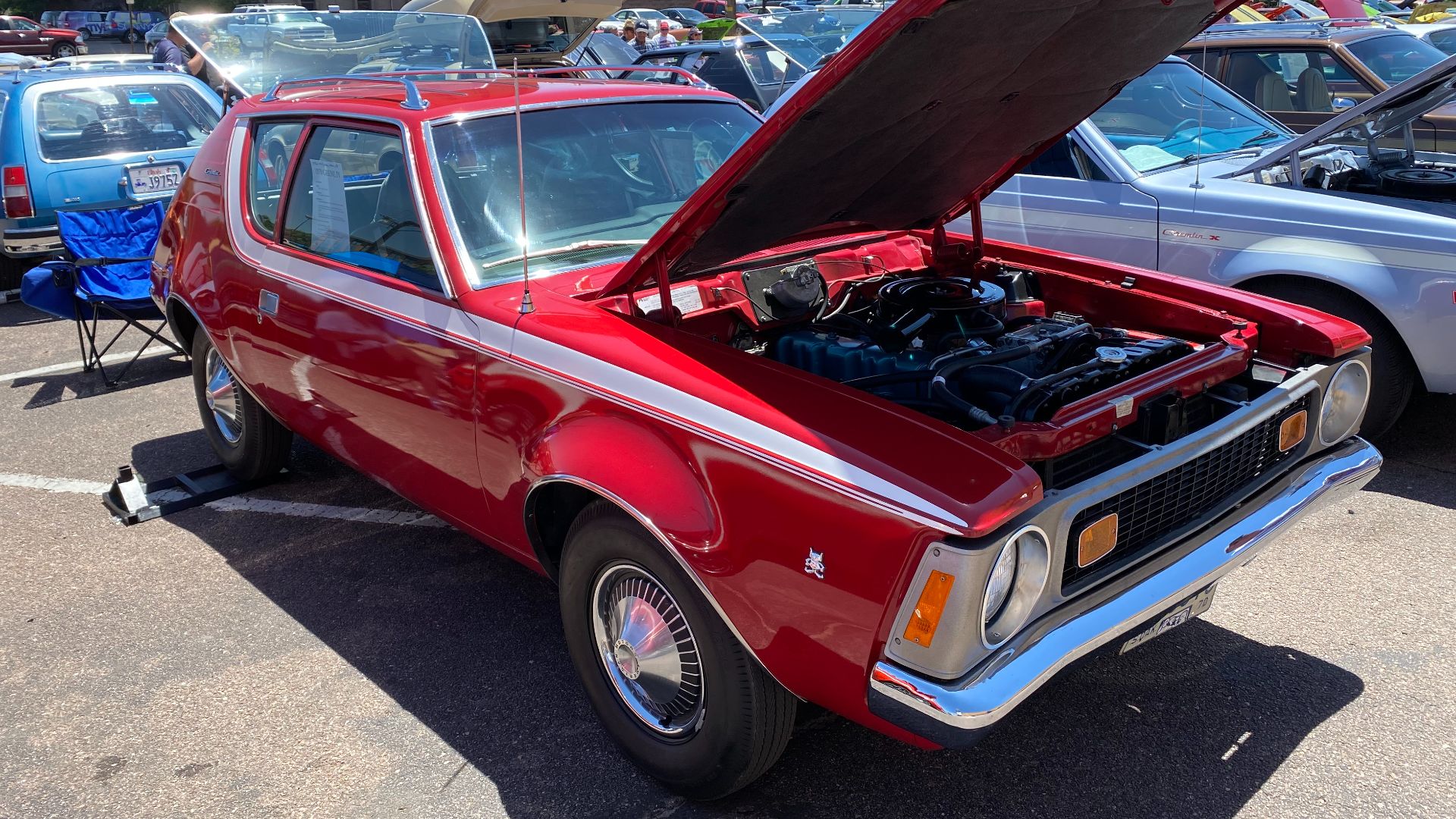 File:1970 AMC Gremlin all original finished in red with white stripe 232 auto AC at 2021 AMO meet 02of15.jpg