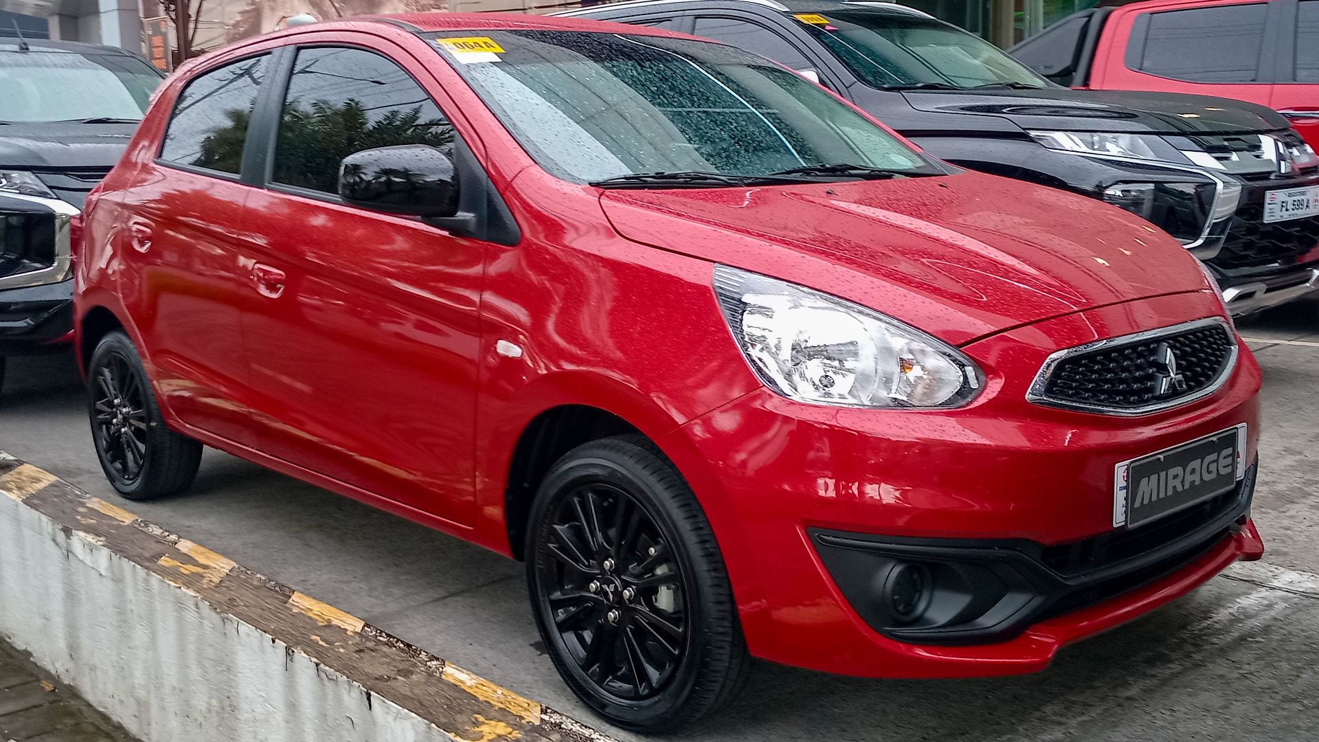 File:2024 Mitsubishi Mirage 1.2 GLX in Red Metallic, front right, 07-04-2024.jpg