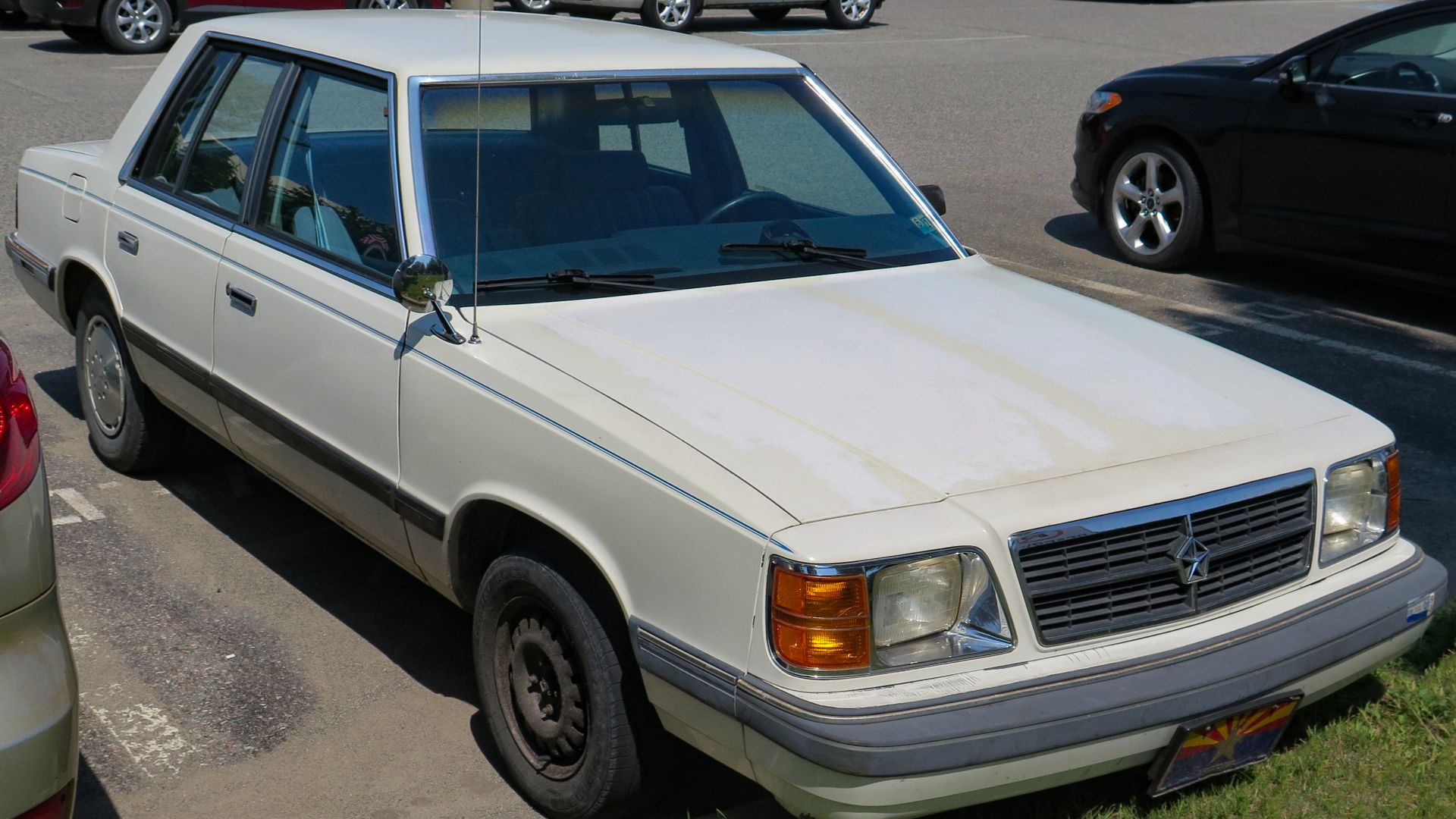 File:1985 Dodge Aries SE four-door in White Crystal Coat, front right, 2023-07-25.jpg