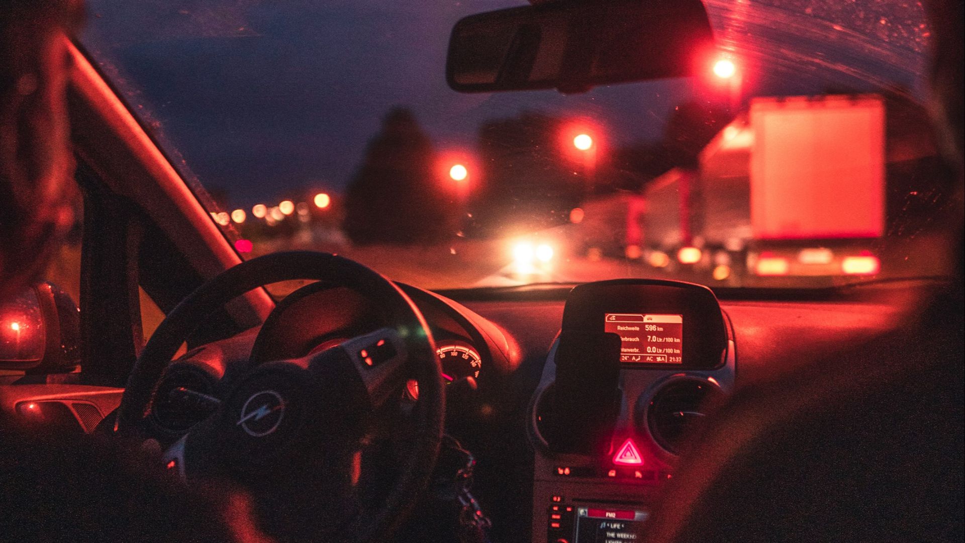man driving car during night time