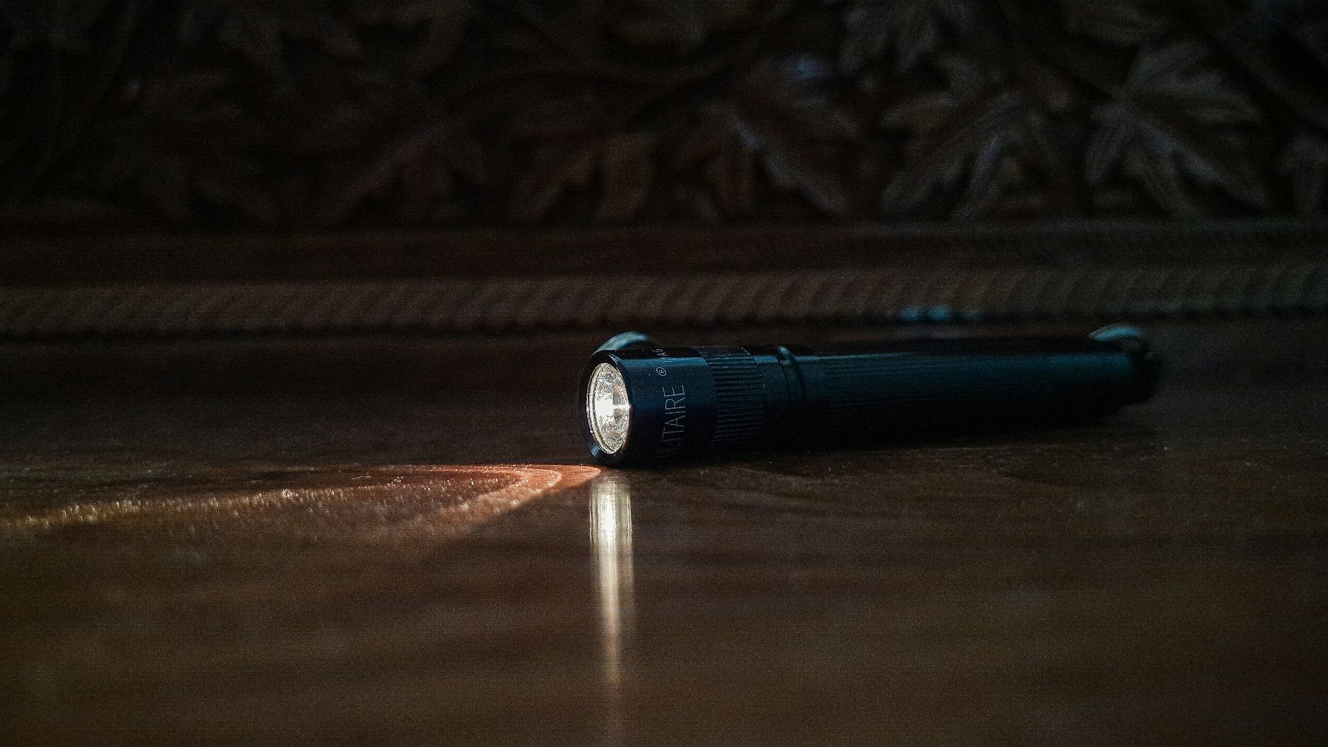 a flashlight sitting on the floor of a room